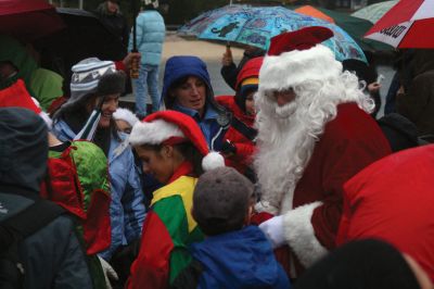 Santa's Arrival
Marion children gave a rock stars welcome to Santa Claus, who arrived at Marions Annual Holiday Stroll by boat on December 13. The pouring rain didnt stop Santa from spreading candy and holiday cheer to the crowd of exciting children. Clydesdale horses waited patiently to take visitors on a stroll through the village, and the town Christmas tree was lit at Bicentennial Park. Photo by Anne OBrien-Kakley.
