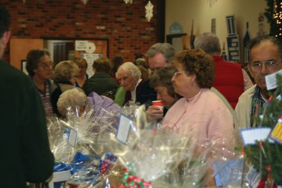 Christmas Holiday Shop
St. Anthonys and St. Ritas parishioners combined efforts to give the community a Christmas Holiday Shop and Celebration on Saturday, December 5, 2009. The basement of St. Anthonys church was decked out in snowflakes, wreaths, bells, bows, and a Santa sleigh. Santa listened patiently as children told him what they wanted for Christmas. A beautiful bake table tempted visitors with gooey confections and warm malasadas were enjoyed by all. Photo by Anne OBrien-Kakley.
