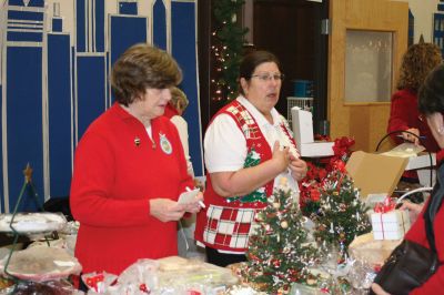 Christmas Holiday Shop
St. Anthonys and St. Ritas parishioners combined efforts to give the community a Christmas Holiday Shop and Celebration on Saturday, December 5, 2009. The basement of St. Anthonys church was decked out in snowflakes, wreaths, bells, bows, and a Santa sleigh. Santa listened patiently as children told him what they wanted for Christmas. A beautiful bake table tempted visitors with gooey confections and warm malasadas were enjoyed by all. Photo by Anne OBrien-Kakley.
