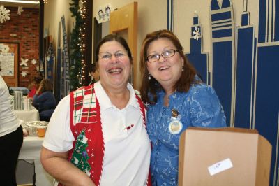 Christmas Holiday Shop
St. Anthonys and St. Ritas parishioners combined efforts to give the community a Christmas Holiday Shop and Celebration on Saturday, December 5, 2009. The basement of St. Anthonys church was decked out in snowflakes, wreaths, bells, bows, and a Santa sleigh. Santa listened patiently as children told him what they wanted for Christmas. A beautiful bake table tempted visitors with gooey confections and warm malasadas were enjoyed by all. Photo by Anne OBrien-Kakley.
