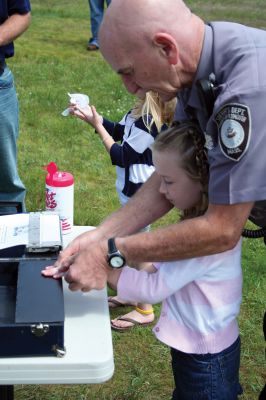 Safety Days
The Marion Police Brotherhood hosted their first annual Public Safety Day at Marion's Silvershell Beach on Saturday, June 13. The event included the installation of child safety seats in residents' vehicles, fingerprint and photo id cards for children along with displays from a variety of local, state and federal government public safety agencies. Photo by Robert Chiarito.
