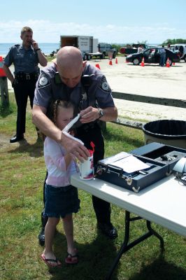 Safety Days
The Marion Police Brotherhood hosted their first annual Public Safety Day at Marion's Silvershell Beach on Saturday, June 13. The event included the installation of child safety seats in residents' vehicles, fingerprint and photo id cards for children along with displays from a variety of local, state and federal government public safety agencies. Photo by Robert Chiarito.
