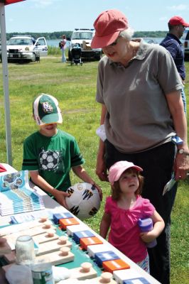 Safety Days
The Marion Police Brotherhood hosted their first annual Public Safety Day at Marion's Silvershell Beach on Saturday, June 13. The event included the installation of child safety seats in residents' vehicles, fingerprint and photo id cards for children along with displays from a variety of local, state and federal government public safety agencies. Photo by Robert Chiarito.
