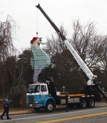 A Salty Holiday
Salty get's his holiday hat placed by Corey Silva of Brownell Systems.  Photo by Paul Lopes
