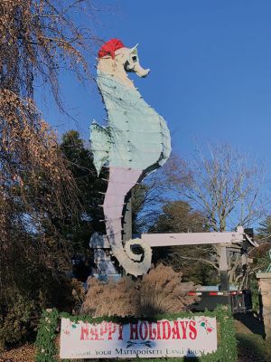 Salty's Hat
Mattapoisett’s most beloved seahorse got his Santa hat on Tuesday, December 4. The Mattapoisett Land Trust’s annual tradition continues with help from the folks at Brownell Systems and their trusty crane. This year Alan Johnson braved a fear of heights to place the hat on top of Salty the Seahorse’s head just right as MLT’s Jenny Mello directed from below and Brownell’s Tom Checkman operated the crane’s controls. Photos by Jean Perry
