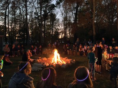 Salty Soiree
The annual Mattapoisett Land Trust Salty Soiree held on October 22 at Dunseith Park was a huge success, as young and old enjoyed a fire pit, 200 luminaries and s'mores. Adding to the festive event was music provided by Jeff Dunn and unique, fantasy-filled puppet stories and songs by Jackson Gillman. MLT's Director and Chair of the Education Committee Ellen Flynn noted in her “thank you” message that Center School students have "artfully decorated the luminaries in Halloween and traditional art." She also ga
