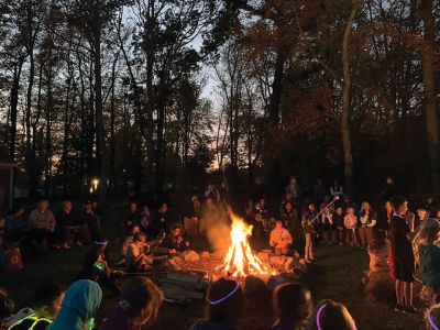 Salty Soiree
The annual Mattapoisett Land Trust Salty Soiree held on October 22 at Dunseith Park was a huge success, as young and old enjoyed a fire pit, 200 luminaries and s'mores. Adding to the festive event was music provided by Jeff Dunn and unique, fantasy-filled puppet stories and songs by Jackson Gillman. MLT's Director and Chair of the Education Committee Ellen Flynn noted in her “thank you” message that Center School students have "artfully decorated the luminaries in Halloween and traditional art." She also ga
