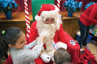 Pizza with Santa
The Marion Police Brotherhood held its 5th annual Pizza with Santa on Sunday, December 4, at the Marion Music Hall. Kids shared a pie with jolly old Saint Nick and later posed for pictures. Photos by Colin Veitch
