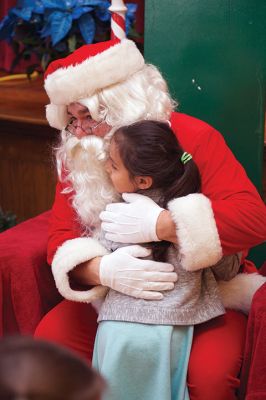 Pizza with Santa
The Marion Police Brotherhood held its 5th annual Pizza with Santa on Sunday, December 4, at the Marion Music Hall. Kids shared a pie with jolly old Saint Nick and later posed for pictures. Photos by Colin Veitch
