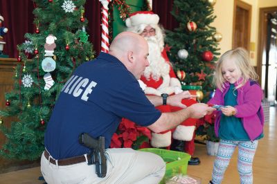 Pizza with Santa
The Marion Police Brotherhood held its annual “Pizza with Santa” on Sunday, December 6, keeping up the tradition of collecting toy donations for its “Stuff a Cruiser” toy drive to benefit those served by the Justice Resource Institute. Marion Police say this was the biggest year yet for toy donations. Photos by Colin Veitch
