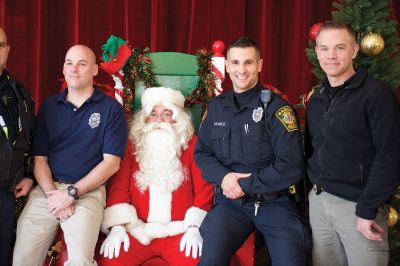 Pizza with Santa
The Marion Police Brotherhood held its annual “Pizza with Santa” on Sunday, December 6, keeping up the tradition of collecting toy donations for its “Stuff a Cruiser” toy drive to benefit those served by the Justice Resource Institute. Marion Police say this was the biggest year yet for toy donations. Photos by Colin Veitch
