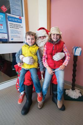 Santa at the Rochester Post Office
Santa made a stop at the Rochester Post Office on December 20 to collect some letters from Tri-Town children and to take some time to visit with the kids and have a little juice and cookies. Photos by Felix Perez
