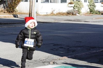 Santa Run 
Saturday, December 7, was the Santa Run 5k through the village of Mattapoisett. Usually held in New Bedford, race organizer Geoff Smith moved the race to Mattapoisett, flooding the village streets with hundreds of Santas – and a few Christmas miniature horses, as well. Photos by Jean Perry
