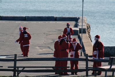 Santa Run 
Saturday, December 7, was the Santa Run 5k through the village of Mattapoisett. Usually held in New Bedford, race organizer Geoff Smith moved the race to Mattapoisett, flooding the village streets with hundreds of Santas – and a few Christmas miniature horses, as well. Photos by Jean Perry
