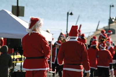 Santa Run 
Saturday, December 7, was the Santa Run 5k through the village of Mattapoisett. Usually held in New Bedford, race organizer Geoff Smith moved the race to Mattapoisett, flooding the village streets with hundreds of Santas – and a few Christmas miniature horses, as well. Photos by Jean Perry
