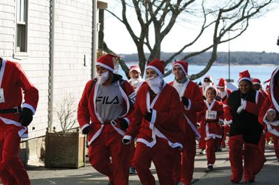 Santa Run 
Saturday, December 7, was the Santa Run 5k through the village of Mattapoisett. Usually held in New Bedford, race organizer Geoff Smith moved the race to Mattapoisett, flooding the village streets with hundreds of Santas – and a few Christmas miniature horses, as well. Photos by Jean Perry
