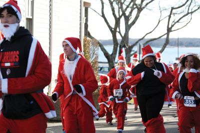 Santa Run 
Saturday, December 7, was the Santa Run 5k through the village of Mattapoisett. Usually held in New Bedford, race organizer Geoff Smith moved the race to Mattapoisett, flooding the village streets with hundreds of Santas – and a few Christmas miniature horses, as well. Photos by Jean Perry
