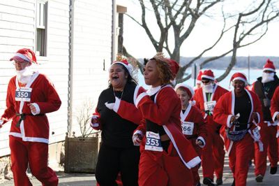 Santa Run 
Saturday, December 7, was the Santa Run 5k through the village of Mattapoisett. Usually held in New Bedford, race organizer Geoff Smith moved the race to Mattapoisett, flooding the village streets with hundreds of Santas – and a few Christmas miniature horses, as well. Photos by Jean Perry
