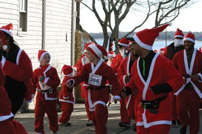 Santa Run 
Saturday, December 7, was the Santa Run 5k through the village of Mattapoisett. Usually held in New Bedford, race organizer Geoff Smith moved the race to Mattapoisett, flooding the village streets with hundreds of Santas – and a few Christmas miniature horses, as well. Photos by Jean Perry
