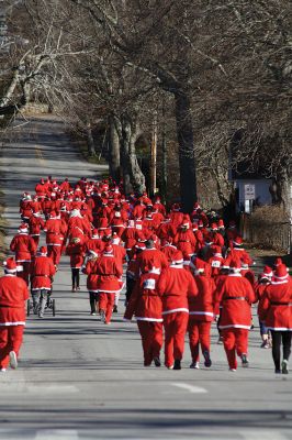 Santa Run 
Saturday, December 7, was the Santa Run 5k through the village of Mattapoisett. Usually held in New Bedford, race organizer Geoff Smith moved the race to Mattapoisett, flooding the village streets with hundreds of Santas – and a few Christmas miniature horses, as well. Photos by Jean Perry
