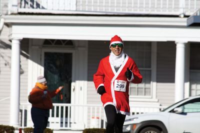 Santa Run 
Saturday, December 7, was the Santa Run 5k through the village of Mattapoisett. Usually held in New Bedford, race organizer Geoff Smith moved the race to Mattapoisett, flooding the village streets with hundreds of Santas – and a few Christmas miniature horses, as well. Photos by Jean Perry
