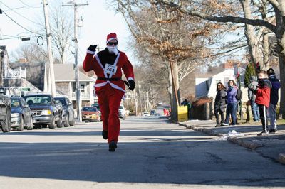 Santa Run 
Saturday, December 7, was the Santa Run 5k through the village of Mattapoisett. Usually held in New Bedford, race organizer Geoff Smith moved the race to Mattapoisett, flooding the village streets with hundreds of Santas – and a few Christmas miniature horses, as well. Photos by Jean Perry
