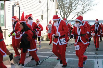 Santa Run 
Saturday, December 7, was the Santa Run 5k through the village of Mattapoisett. Usually held in New Bedford, race organizer Geoff Smith moved the race to Mattapoisett, flooding the village streets with hundreds of Santas – and a few Christmas miniature horses, as well. Photos by Jean Perry
