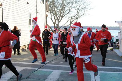 Santa Run 
Saturday, December 7, was the Santa Run 5k through the village of Mattapoisett. Usually held in New Bedford, race organizer Geoff Smith moved the race to Mattapoisett, flooding the village streets with hundreds of Santas – and a few Christmas miniature horses, as well. Photos by Jean Perry
