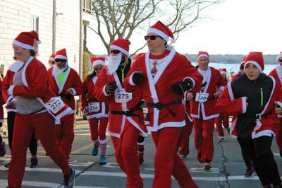 Santa Run 
Saturday, December 7, was the Santa Run 5k through the village of Mattapoisett. Usually held in New Bedford, race organizer Geoff Smith moved the race to Mattapoisett, flooding the village streets with hundreds of Santas – and a few Christmas miniature horses, as well. Photos by Jean Perry
