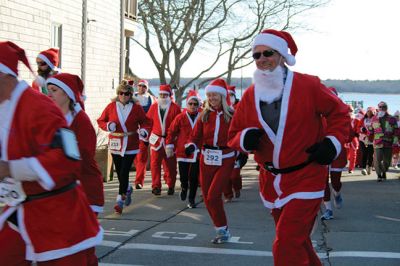 Santa Run 
Saturday, December 7, was the Santa Run 5k through the village of Mattapoisett. Usually held in New Bedford, race organizer Geoff Smith moved the race to Mattapoisett, flooding the village streets with hundreds of Santas – and a few Christmas miniature horses, as well. Photos by Jean Perry
