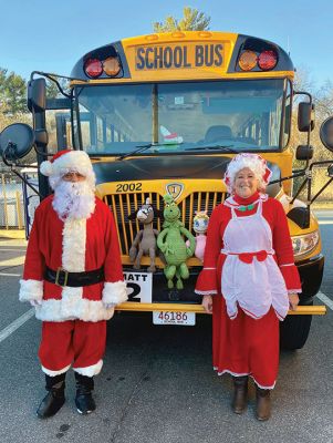 Santa Bus
Amaral Bus drivers Jeff Saladino (Matt 7) and Dianne Freitas (Matt 2) had fun surprising the students driving the buses on December 23. Photo by Cheryl Sweeney
