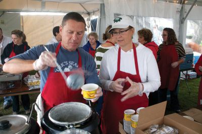 Harvest Moon Seafood Festival
Patrick Moran (left) and Kathy Costello (right) volunteered to help dispense clam chowder at the first Harvest Moon Seafood Festival at Shipyard Park on October 14, 2012.  The event was held in honor of Richard "Turk" Pasquill, founder of Turk's Seafood Restaurant.  Photo by Eric Tripoli.
