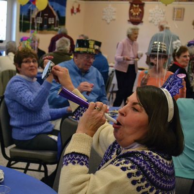 Noon Year’s Eve
The year 2014 arrived a little early on Tuesday afternoon for the guests at the Senior Center’s Annual New Year’s Eve party. It was a “Noon Year’s Eve” party of sorts, with more than enough shiny hats and tiaras, colorful noisemakers, bright balloons, and champagne to go around. Photo by Jean Perry
