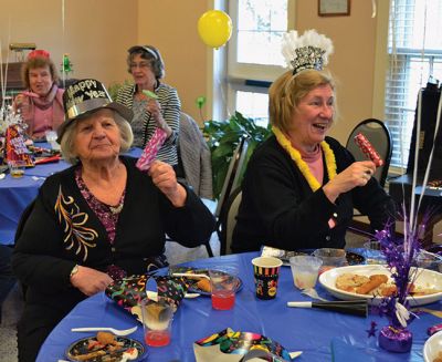 Noon Year’s Eve
The year 2014 arrived a little early on Tuesday afternoon for the guests at the Senior Center’s Annual New Year’s Eve party. It was a “Noon Year’s Eve” party of sorts, with more than enough shiny hats and tiaras, colorful noisemakers, bright balloons, and champagne to go around. Photo by Jean Perry
