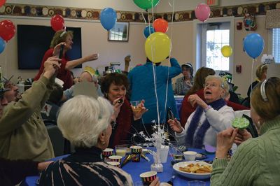 Noon Year’s Eve
The year 2014 arrived a little early on Tuesday afternoon for the guests at the Senior Center’s Annual New Year’s Eve party. It was a “Noon Year’s Eve” party of sorts, with more than enough shiny hats and tiaras, colorful noisemakers, bright balloons, and champagne to go around. Photo by Jean Perry
