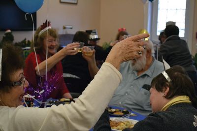 Noon Year’s Eve
The year 2014 arrived a little early on Tuesday afternoon for the guests at the Senior Center’s Annual New Year’s Eve party. It was a “Noon Year’s Eve” party of sorts, with more than enough shiny hats and tiaras, colorful noisemakers, bright balloons, and champagne to go around. Photo by Jean Perry
