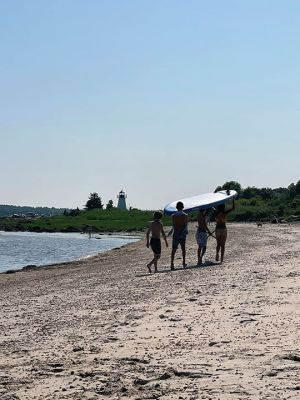 Ned's Point
Beach fun July 5 on Holly Lane beach to Ned's Point. Teens bring a paddleboard along, using coordinated effort, teamwork and upper-body strength. Photo by Jennifer Shepley
