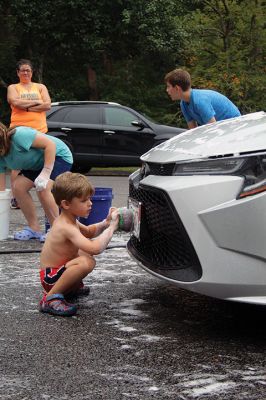 Car Wash
Grade 6 at Sippican Elementary School students turned a dreary Saturday into some fun while washing cars at Marion Fire Station 2 to raise money for their spring-season class trip. Photos by Mick Colageo
