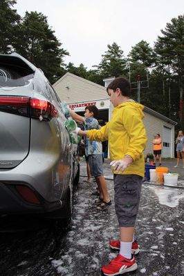 Car Wash
Grade 6 at Sippican Elementary School students turned a dreary Saturday into some fun while washing cars at Marion Fire Station 2 to raise money for their spring-season class trip. Photos by Mick Colageo
