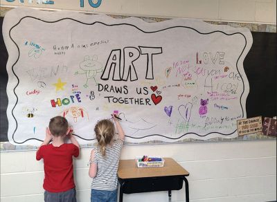 Sippican Arts
Boston artist Bren Bataclan and Sippican Elementary School art teacher Katie Pike show off Bataclan's artwork during the Marion school’s Arts in Action event. Featured work was created by students in Grades K-6 as part of their ongoing Global Art Adventure curriculum. Photos courtesy of Old Rochester Regional School District and MA Superintendency Union #55
