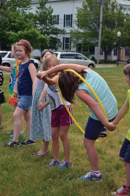 Field Day Fun at Sippican School 
Friday morning we caught some first-graders in the middle of a hula-hoop relay on the grounds of Sippican School. Holding hands and cheering each other on, the kids twisted and turned themselves through the hoops and the first team to get their hoop to travel down and up the line again won the relay. Can you guess which team won? Photo by Jean Perry
