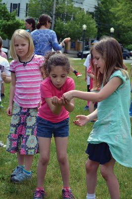 Field Day Fun at Sippican School 
Friday morning we caught some first-graders in the middle of a hula-hoop relay on the grounds of Sippican School. Holding hands and cheering each other on, the kids twisted and turned themselves through the hoops and the first team to get their hoop to travel down and up the line again won the relay. Can you guess which team won? Photo by Jean Perry
