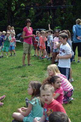 Field Day Fun at Sippican School 
Friday morning we caught some first-graders in the middle of a hula-hoop relay on the grounds of Sippican School. Holding hands and cheering each other on, the kids twisted and turned themselves through the hoops and the first team to get their hoop to travel down and up the line again won the relay. Can you guess which team won? Photo by Jean Perry
