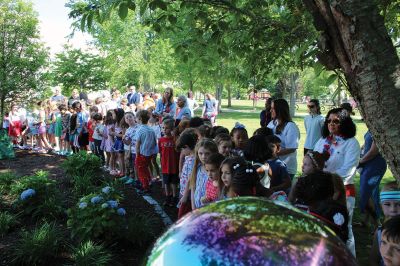 Children’s Memorial Garden
Where for many years stood a tall spruce tree at Sippican Elementary School is now a large stump at the center of a newly dedicated Children’s Memorial Garden honoring the lives of former students Marques Sylvia, Andrew Rego, Alexis Wisner and Cory Jackson. On June 14, Principal Marla Sirois led a celebration of the vision of former Principal Marylou Hobson (1990-2004) and the generosity and effort of Steve Gonsalves, Suzanna Davis, Margie Baldwin and the Pythagorean Lodge. Photos by Mick Colageo
