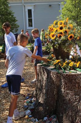 Children’s Memorial Garden
Where for many years stood a tall spruce tree at Sippican Elementary School is now a large stump at the center of a newly dedicated Children’s Memorial Garden honoring the lives of former students Marques Sylvia, Andrew Rego, Alexis Wisner and Cory Jackson. On June 14, Principal Marla Sirois led a celebration of the vision of former Principal Marylou Hobson (1990-2004) and the generosity and effort of Steve Gonsalves, Suzanna Davis, Margie Baldwin and the Pythagorean Lodge. Photos by Mick Colageo
