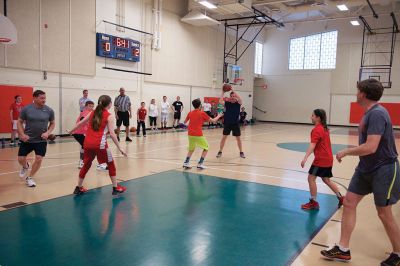 Sippican School Basketball
The Sippican School gymnasium was lit up the night of Thursday, March 23, for the annual sixth grade versus staff and parents basketball game. The adult team seemed to have fun giving the students a consistently hard time throughout, but in the end, it was the students who triumphed 37-33. Photos by Colin Veitch
