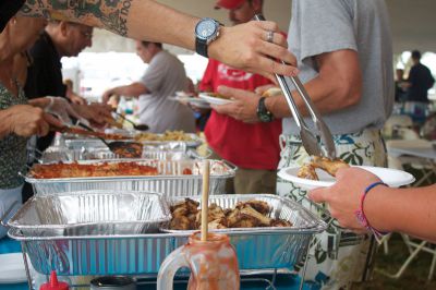 Summer Sizzler 
Dozens of dishes including lasagna, grilled chicken, and seafood were offered at the Men Who Cook event, which was organized by the Women's Center of New Bedford on Sunday, July 15, 2012.  Photo by Eric Tripoli.
