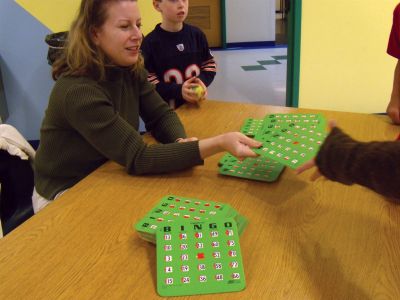 Skip the Screen
On Monday, April 9, Sippican School kicked off its “Skip the Screen” week with a Bingo Night designed to lure families away from the television and computer. Heather Burke hands out bingo cards at the free, VASE-sponsored event. Photo by Laura Fedak Pedulli.
