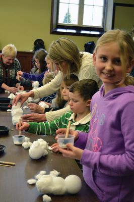 Build-your-own Snowman
Under the direction of Jeanne McCullough, children at the Mattapoisett Free Library on December 30 participated in a step-by-step build-your-own snowperson activity during the winter school break. Little fingers sticky with glue flattened out cotton balls and fastened them to prefabricated Styrofoam snowperson shapes, and then glued on the trimmings under the guidance of caregivers. Photos by Jean Perry
