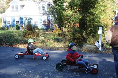 Soapbox Derby
Marion and Rochester Cub Scouts came together on November 6 for a soapbox derby on Holmes Street in Marion. The longtime fundraising event was not held in 2020 due to the coronavirus pandemic but made a roaring return on Saturday, as children raced their homemade go-carts and collected donations for the Murphy and Others, Living Interdependently for Future Endeavors, Inc. (M.O. L.I.F.E.) non-profit food pantry in Fairhaven. Photos by Mick Colageo and Reade Whinnem
